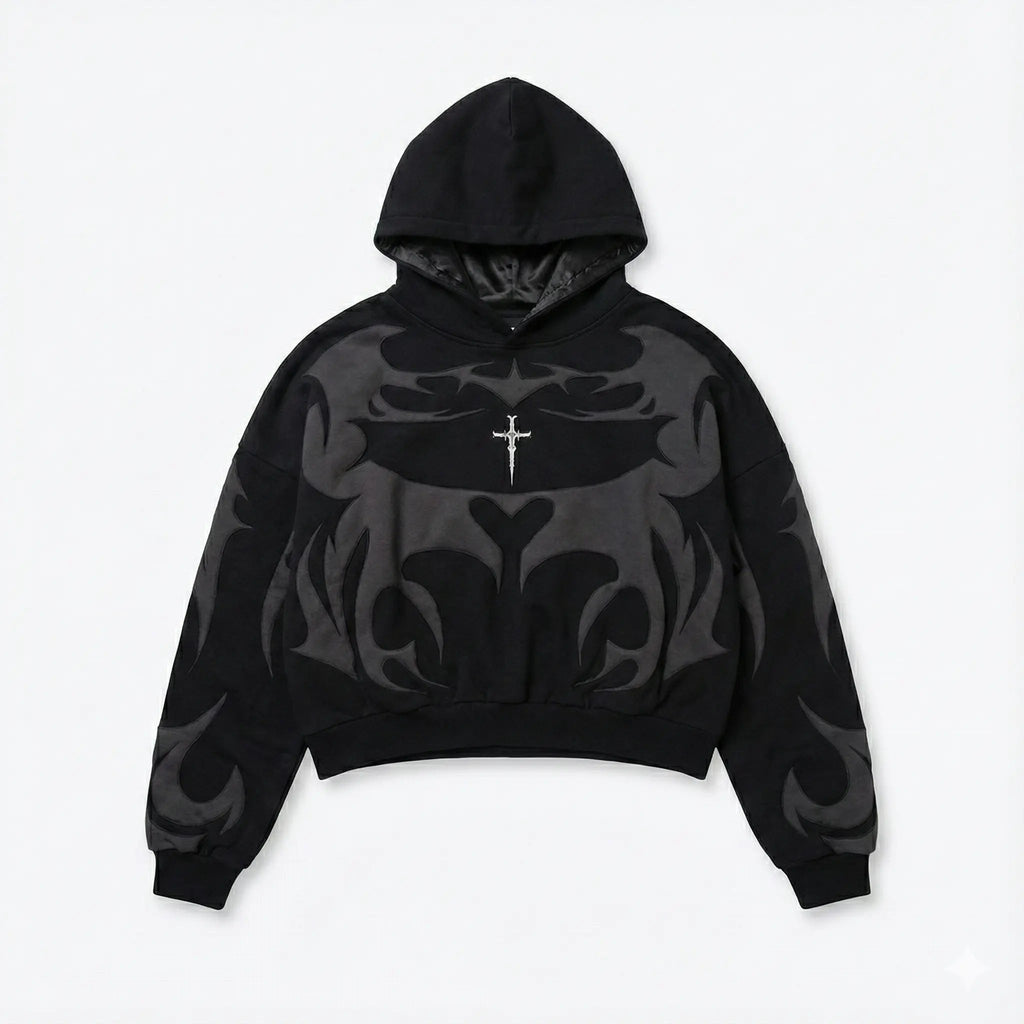 Black streetwear hoodie with bold gray abstract flame design and small cross detail on chest