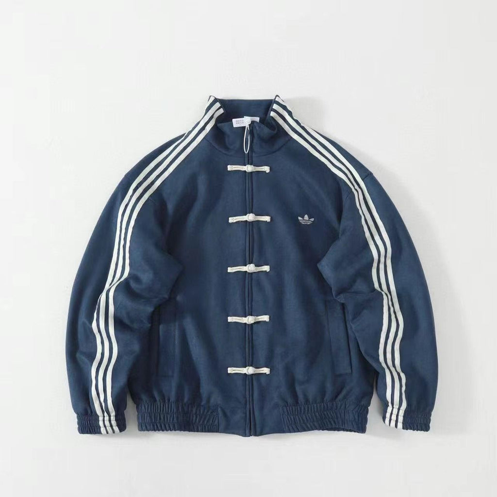 Blue track jacket with white stripes, toggle buttons, and embroidered logo on chest. Chinese New Year Suede Track Jacket – Premium Festive Streetwear