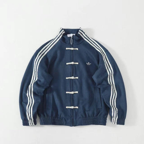 Blue track jacket with white stripes, toggle buttons, and embroidered logo on chest.